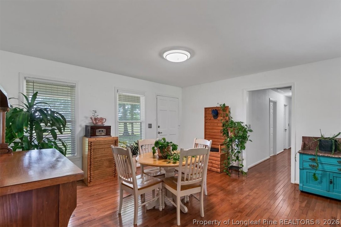 7266 Pleasant Hope Road Fairmont, NC 28340 - Photo 18 of 45 a dining room with furniture and wooden floor
