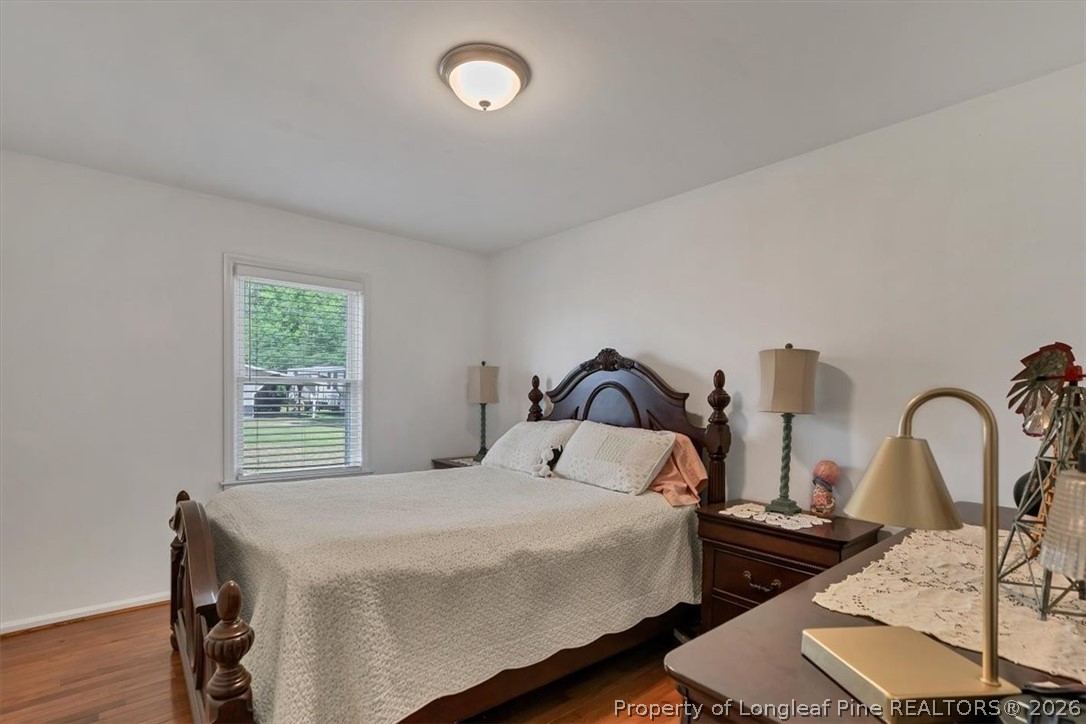 7266 Pleasant Hope Road Fairmont, NC 28340 - Photo 19 of 45 a bedroom with bed and a window