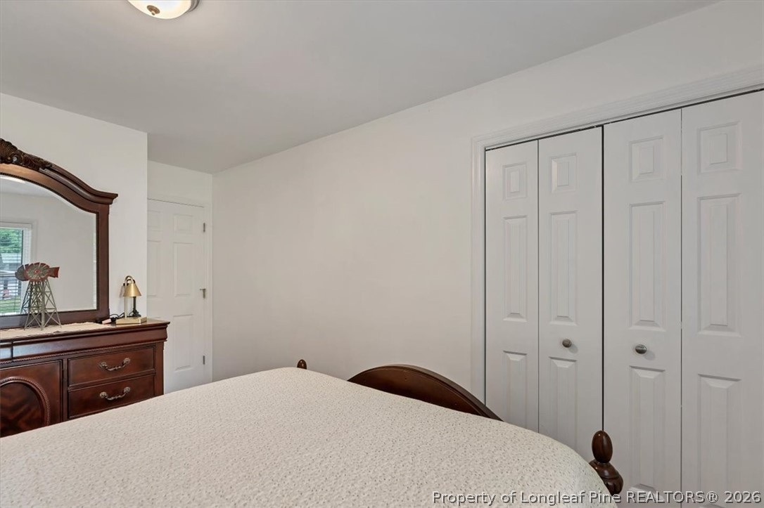 7266 Pleasant Hope Road Fairmont, NC 28340 - Photo 20 of 45 a bedroom with a bed and a dresser