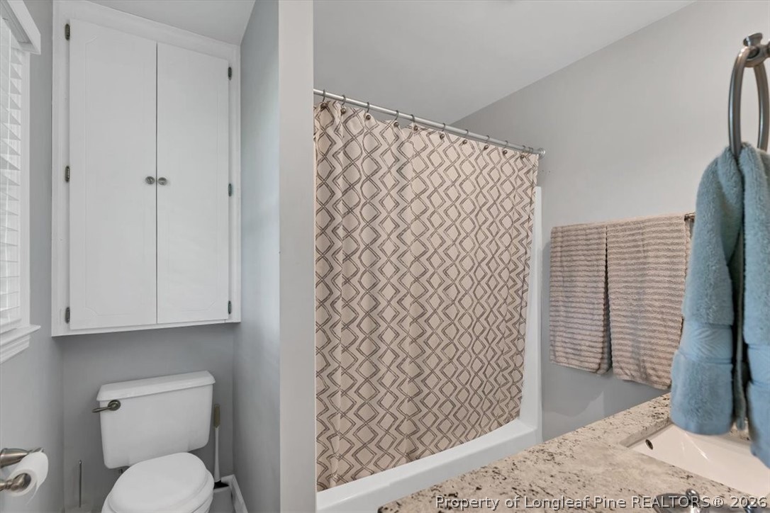 7266 Pleasant Hope Road Fairmont, NC 28340 - Photo 28 of 45 a bathroom with a toilet and a shower