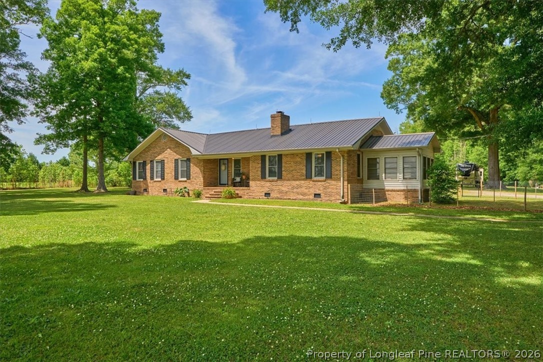 7266 Pleasant Hope Road Fairmont, NC 28340 - Photo 3 of 45 a front view of a house with a yard
