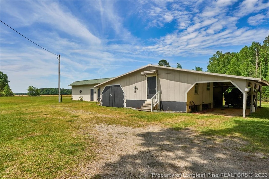 7266 Pleasant Hope Road Fairmont, NC 28340 - Photo 36 of 45 a house view with a outdoor space