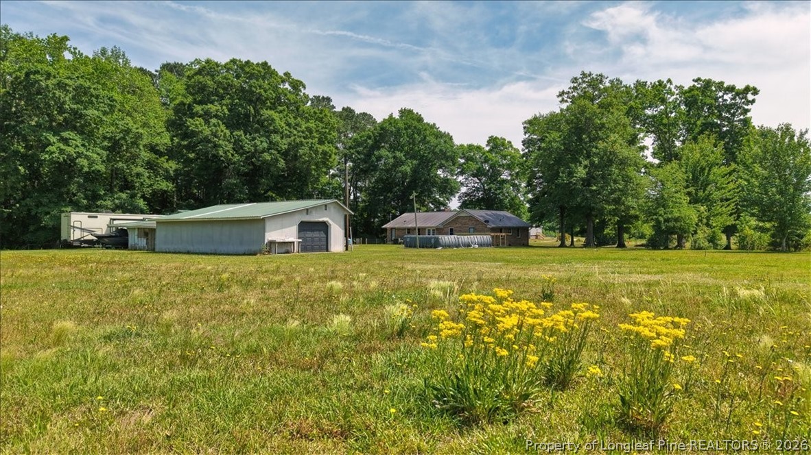 7266 Pleasant Hope Road Fairmont, NC 28340 - Photo 38 of 45 a house view with a garden space