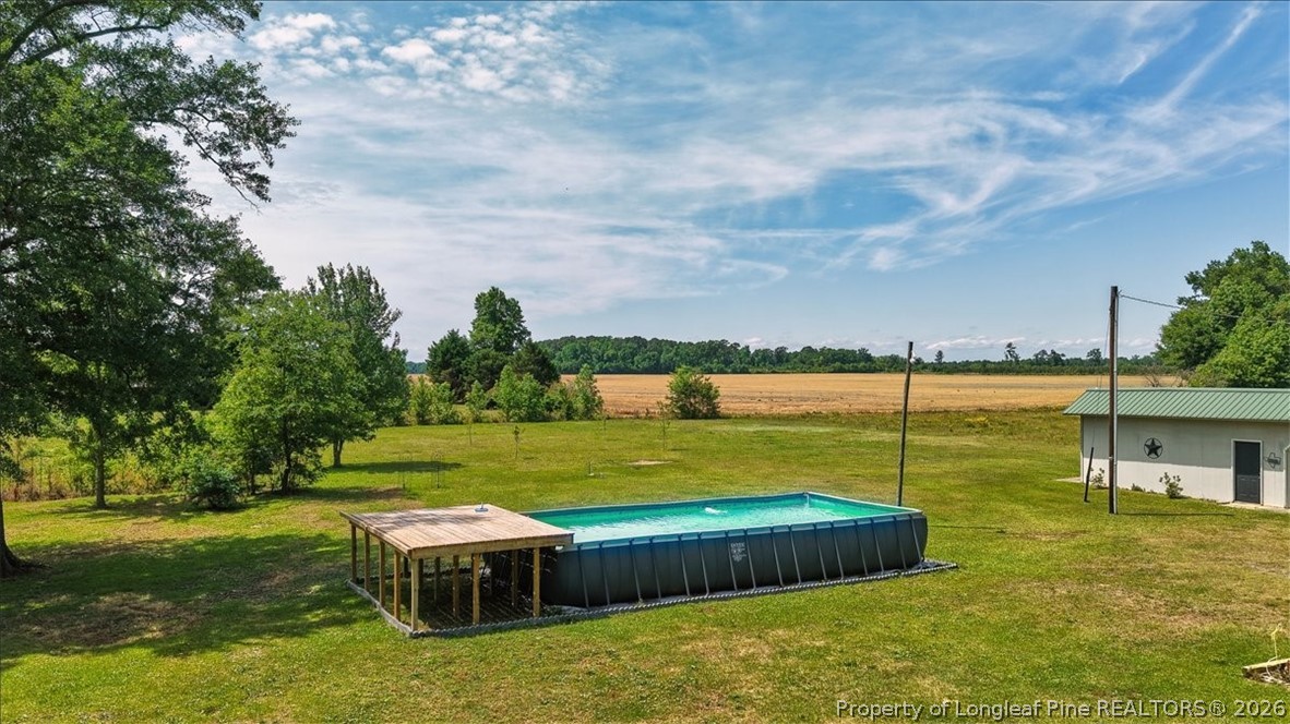 7266 Pleasant Hope Road Fairmont, NC 28340 - Photo 40 of 45 a view of a swimming pool and a yard