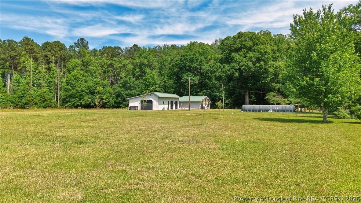 7266 Pleasant Hope Road Fairmont, NC 28340 - Photo 42 of 45 a house view with swimming pool in front of it