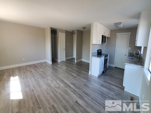 500 Nancy Circle Reno, NV 89503 - Photo 3 of 26 a room with wooden floors and white walls
