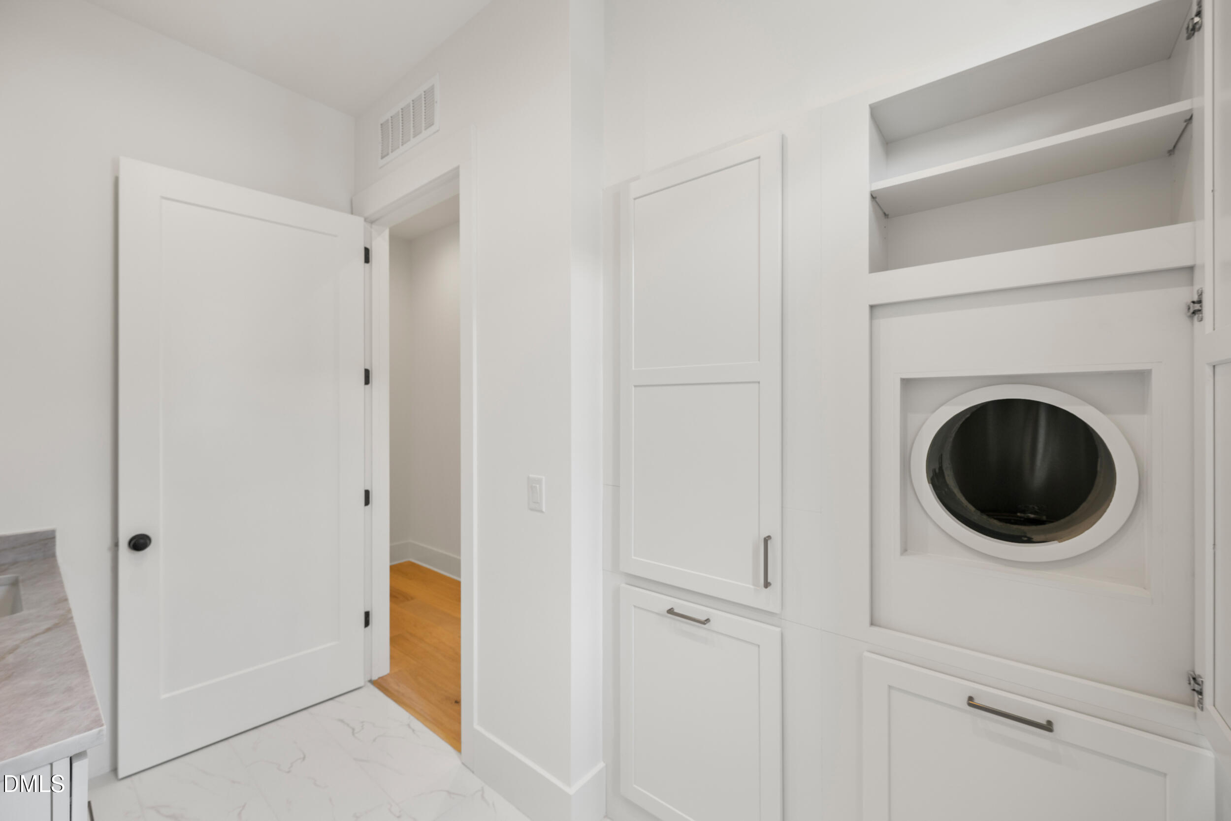 2817 Claremont Road Raleigh, NC 27608 - Photo 28 of 73 a view of a hallway with washer and dryer