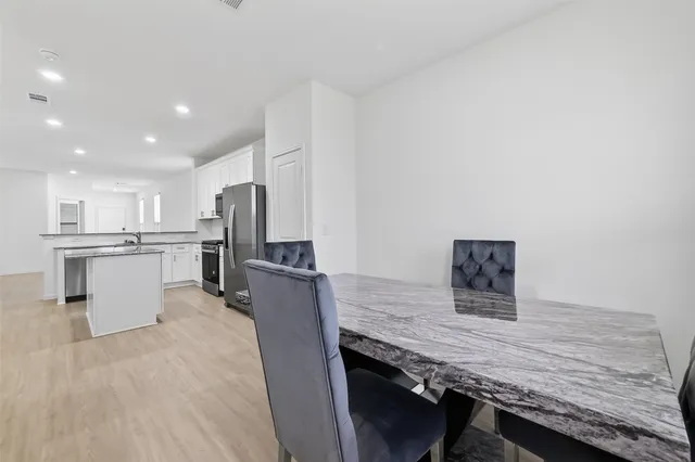 a bathroom with a sink and a large mirror