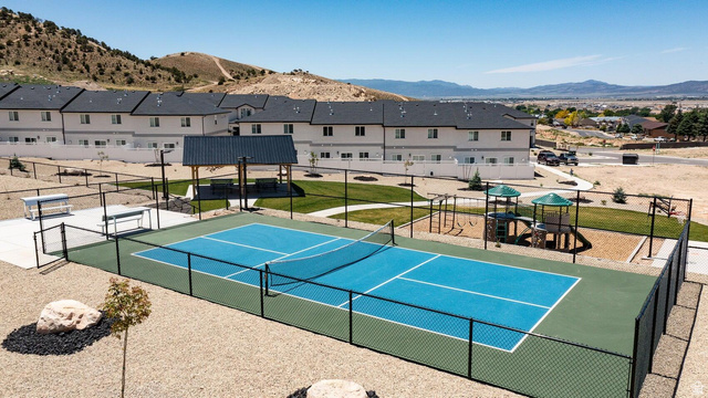 668 East Fiddlers Canyon Road, Unit 24 Cedar City, UT 84721 - Photo 20 of 21 View of tennis court featuring a mountain view, a residential view, and a patio