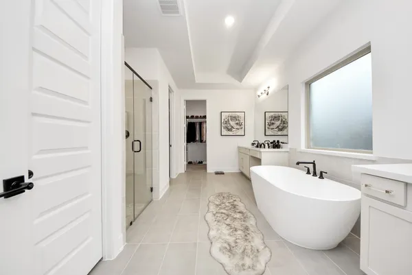 a bathroom with a double vanity sink mirror and double