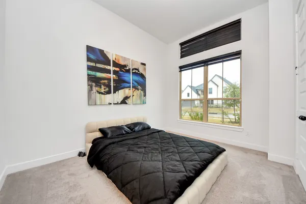 a bedroom with a bed and closet