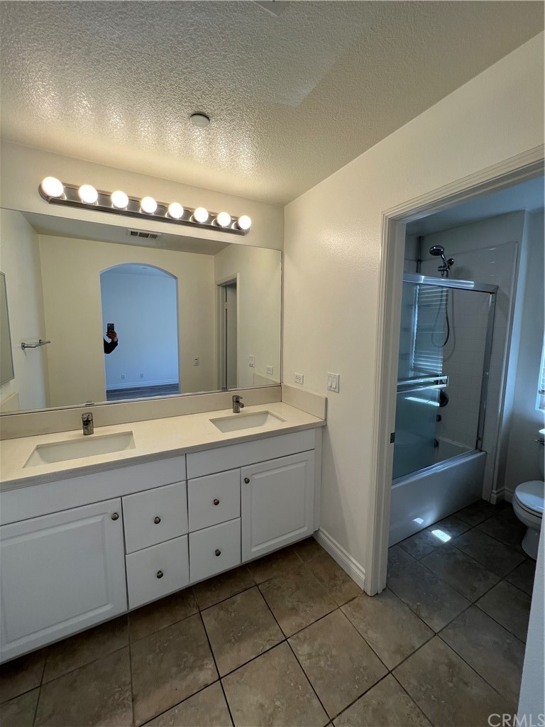 80 Hedge Bloom Irvine, CA 92618 - Photo 6 of 12 a bathroom with double sink and a mirror