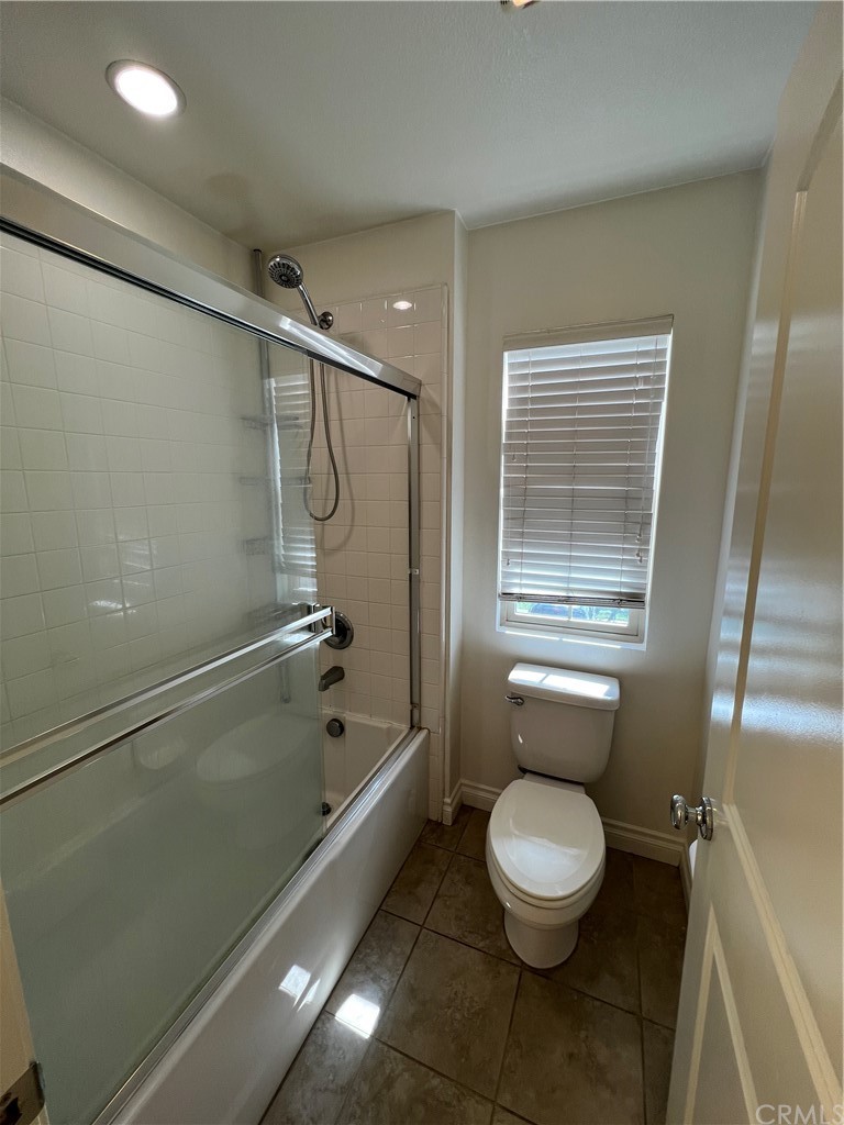 80 Hedge Bloom Irvine, CA 92618 - Photo 10 of 12 a bathroom with a toilet and a shower