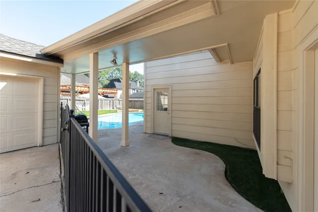 a view of a house with swimming pool in front of it