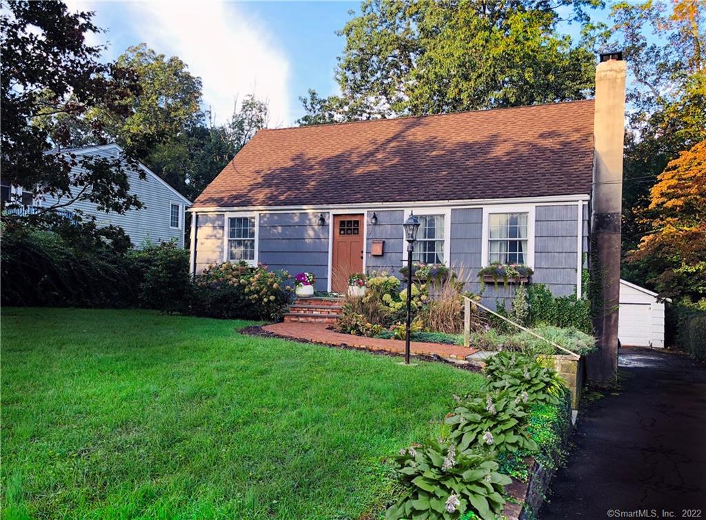 7 Eagle Road Norwalk, CT 06850 - Photo 1 of 1 a front view of a house with a garden