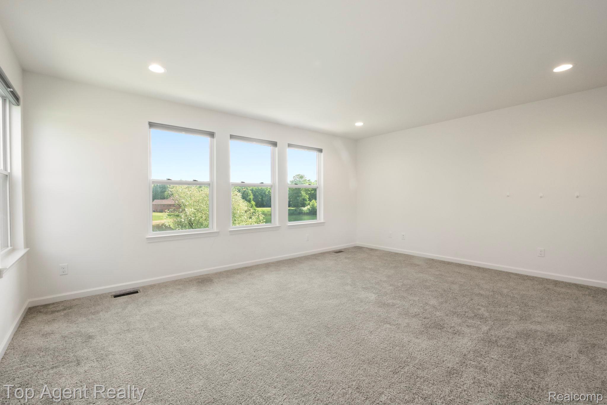 63770 Dequindre Road Washington, MI 48095 - Photo 29 of 61 Spacious room featuring light gray carpeting and white walls
