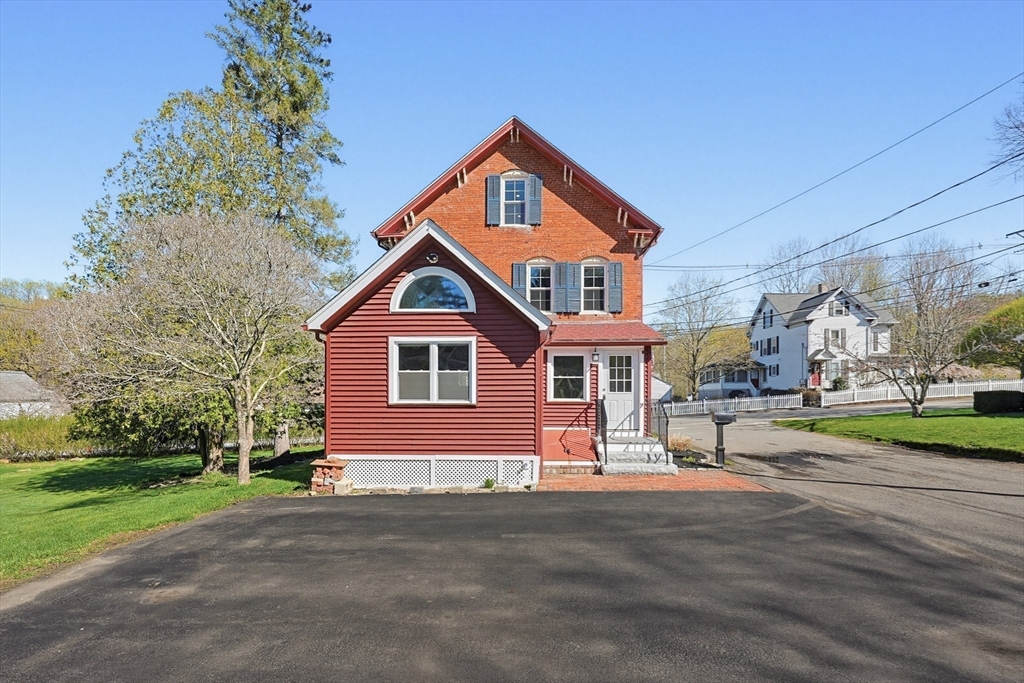 44 Clark Street Spencer, MA 01562 - Photo 28 of 41 a front view of a house with a yard