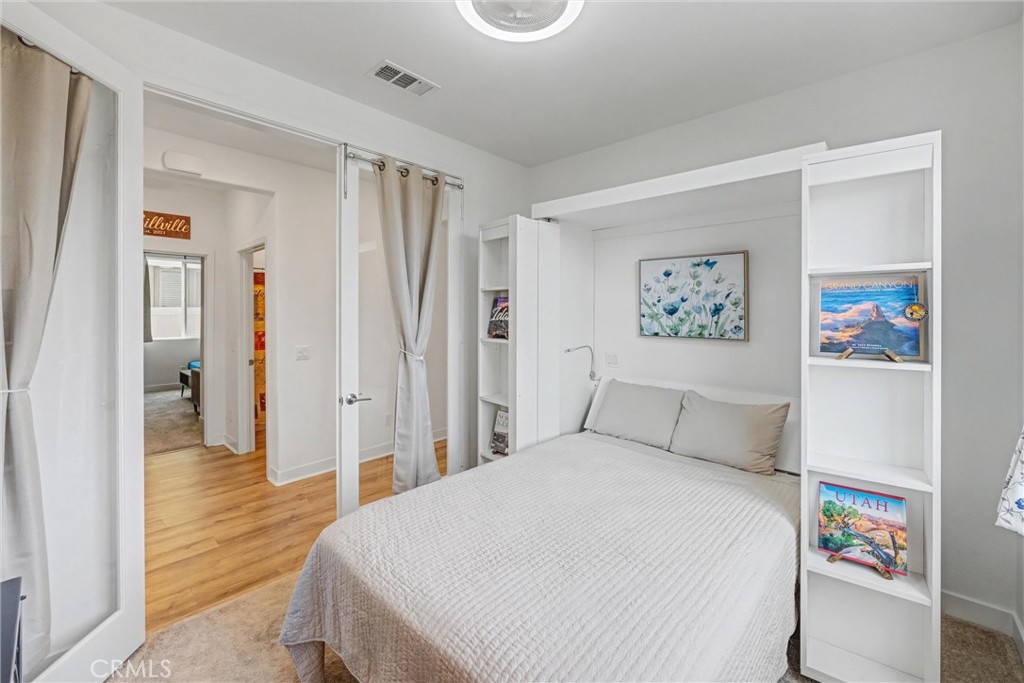 1685 Spring Run Lane Beaumont, CA 92223 - Photo 23 of 57 a bedroom with a bed and a view of bathroom