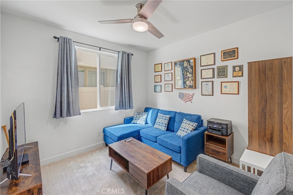 1685 Spring Run Lane Beaumont, CA 92223 - Photo 25 of 57 a living room with furniture and a window