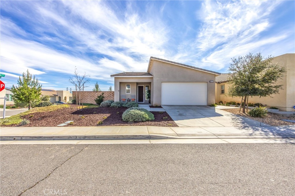 1685 Spring Run Lane Beaumont, CA 92223 - Photo 3 of 57 front view of a house with a yard