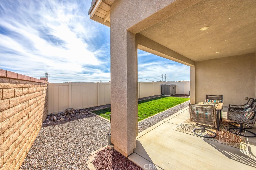 1685 Spring Run Lane Beaumont, CA 92223 - Photo 35 of 57 a view of a porch with furniture and garden