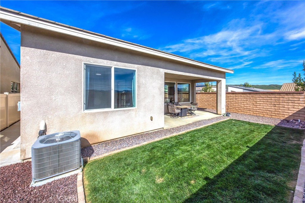 1685 Spring Run Lane Beaumont, CA 92223 - Photo 37 of 57 a front view of a house with a yard