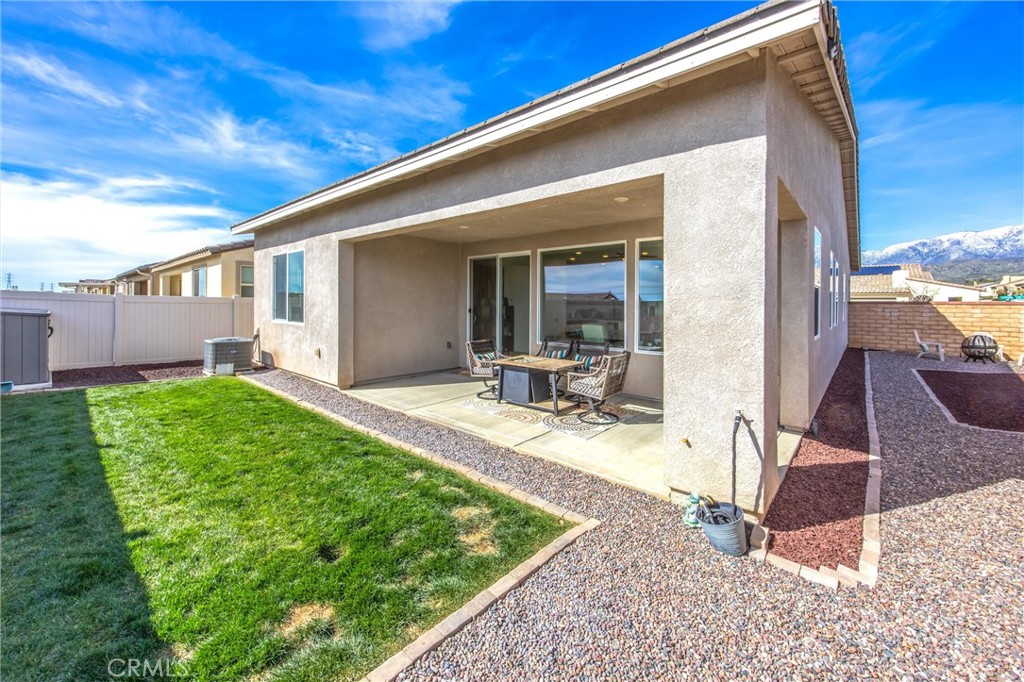 1685 Spring Run Lane Beaumont, CA 92223 - Photo 38 of 57 a view of a backyard with a patio