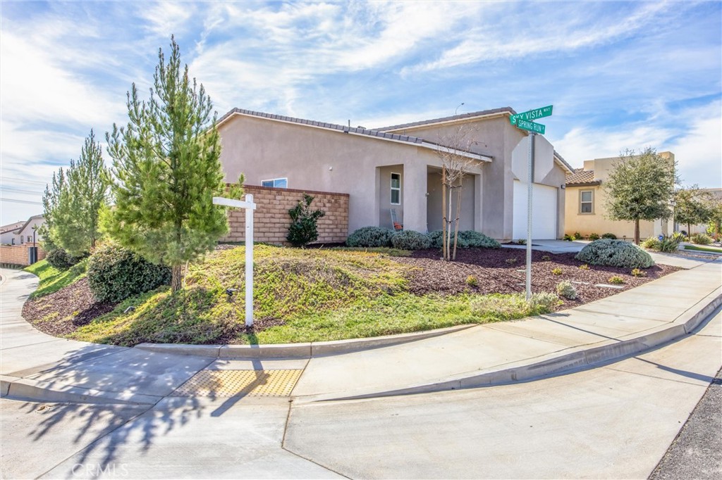 1685 Spring Run Lane Beaumont, CA 92223 - Photo 4 of 57 a view of a house with a yard
