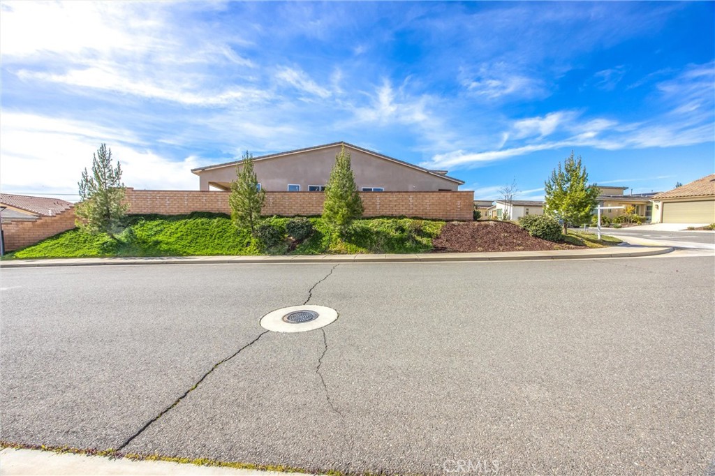 1685 Spring Run Lane Beaumont, CA 92223 - Photo 5 of 57 a view of a lake with a house in the background