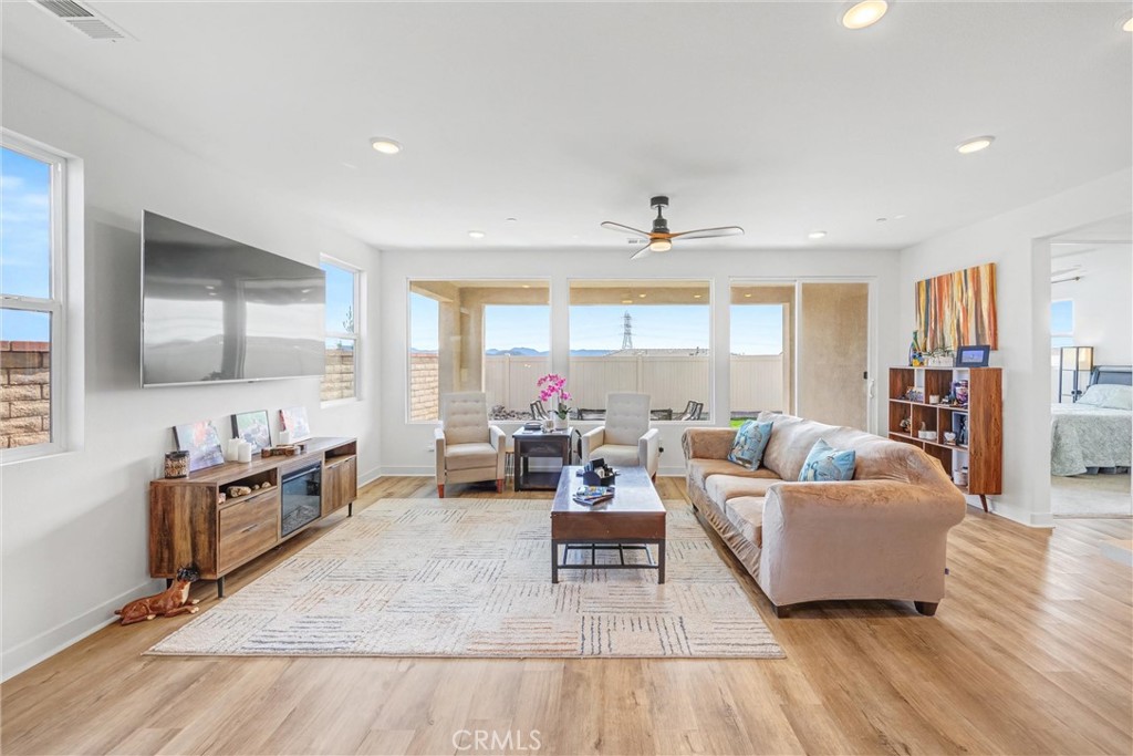 1685 Spring Run Lane Beaumont, CA 92223 - Photo 8 of 57 a living room with furniture and a flat screen tv