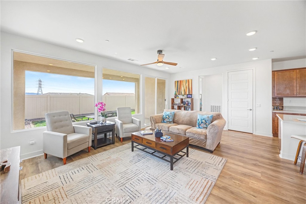 1685 Spring Run Lane Beaumont, CA 92223 - Photo 9 of 57 a living room with furniture and a large window