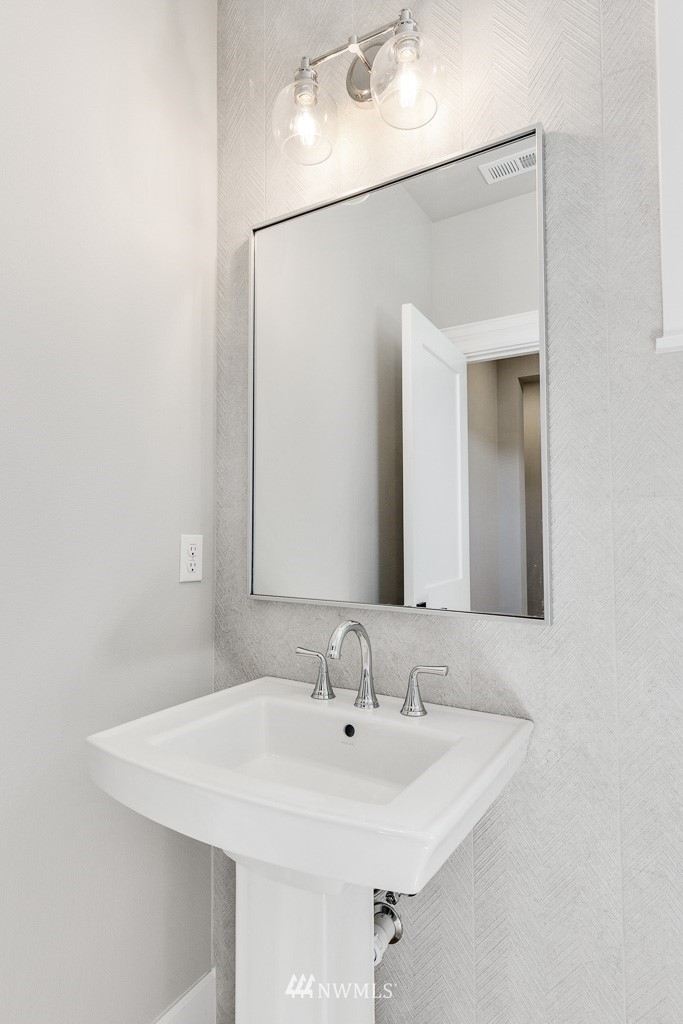 23027 30th Drive Southeast Bothell, WA 98021 - Photo 22 of 30 a bathroom with a sink and a mirror