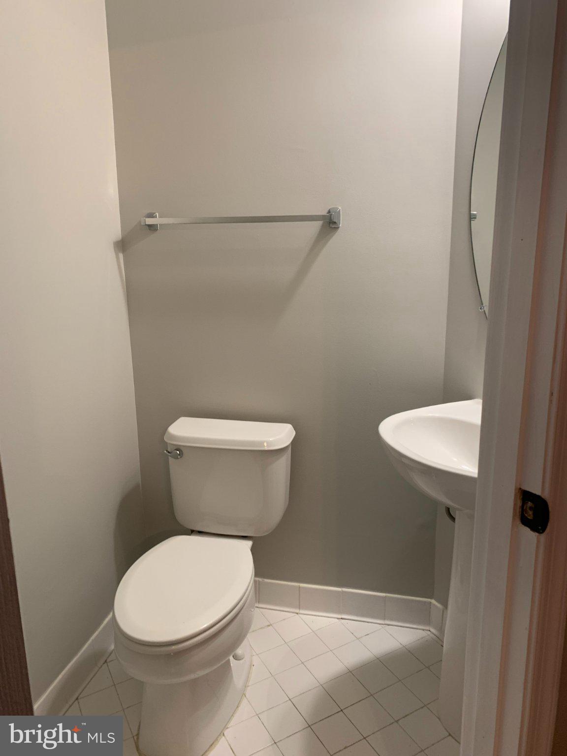 12956 Clarksburg Square Road Clarksburg, MD 20871 - Photo 3 of 16 Sleek and modern half-bath retreat.