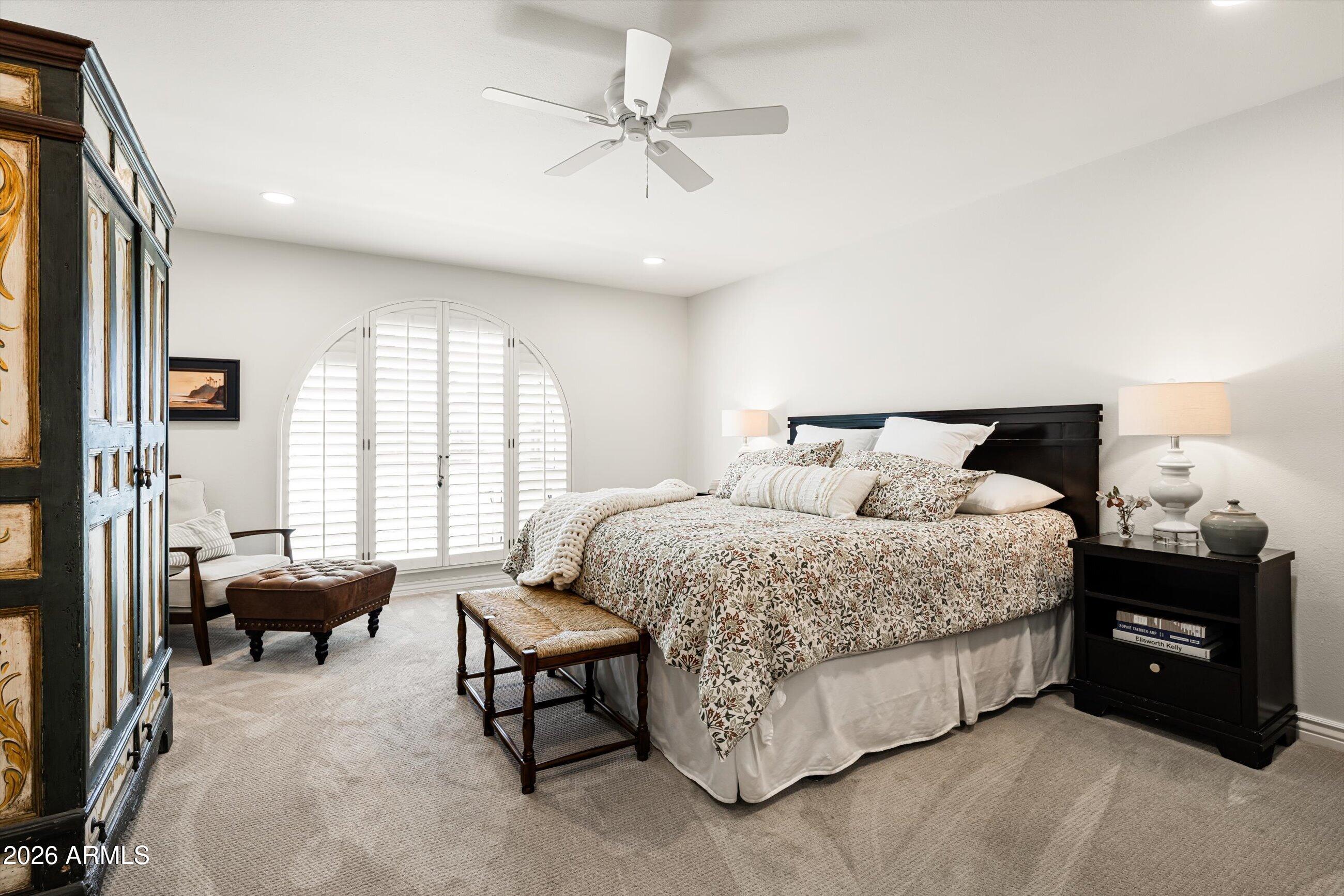 7142 North 14th Street Phoenix, AZ 85020 - Photo 14 of 29 a bed room with a bed and a couch