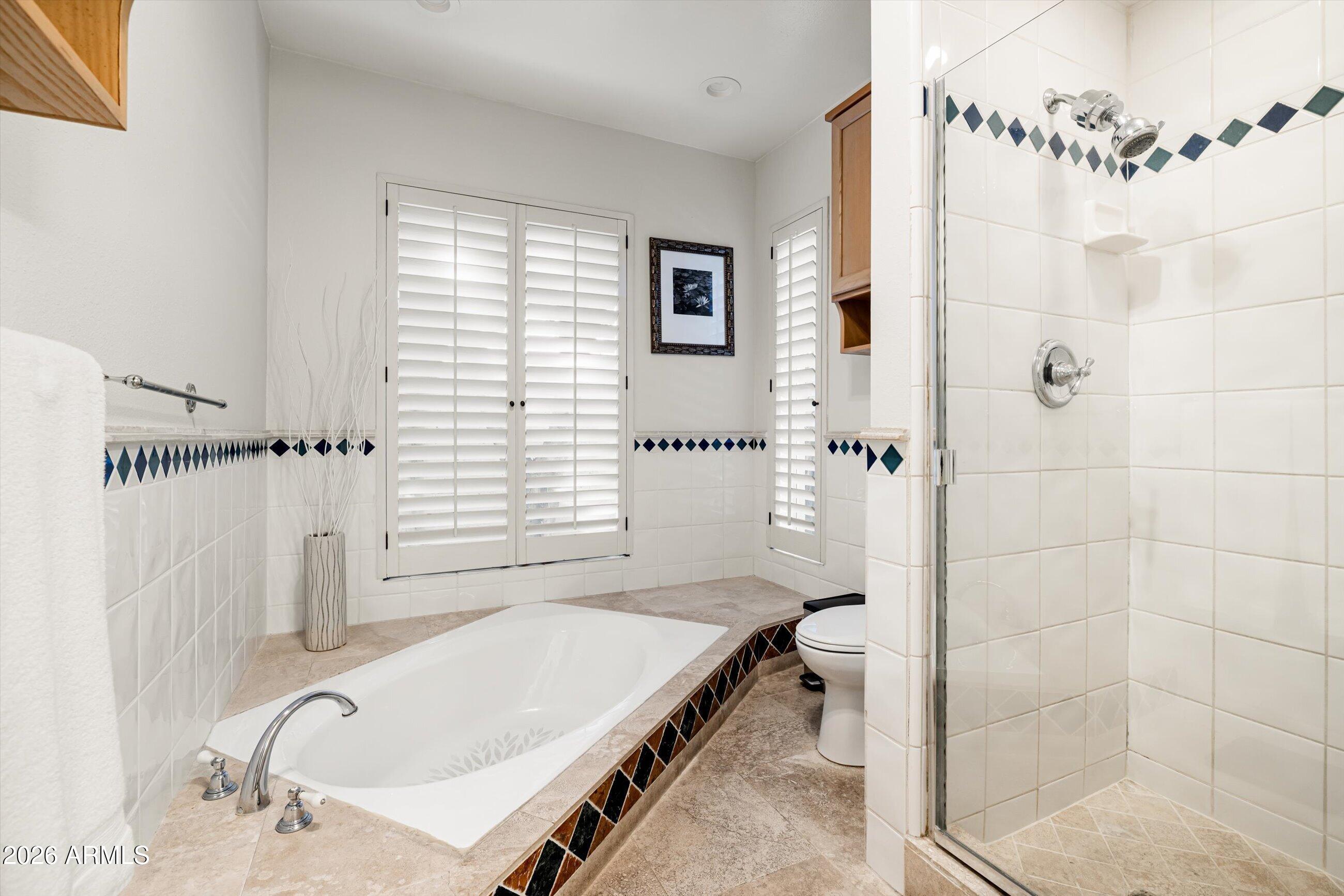 7142 North 14th Street Phoenix, AZ 85020 - Photo 17 of 29 a bathroom with a tub sink and shower