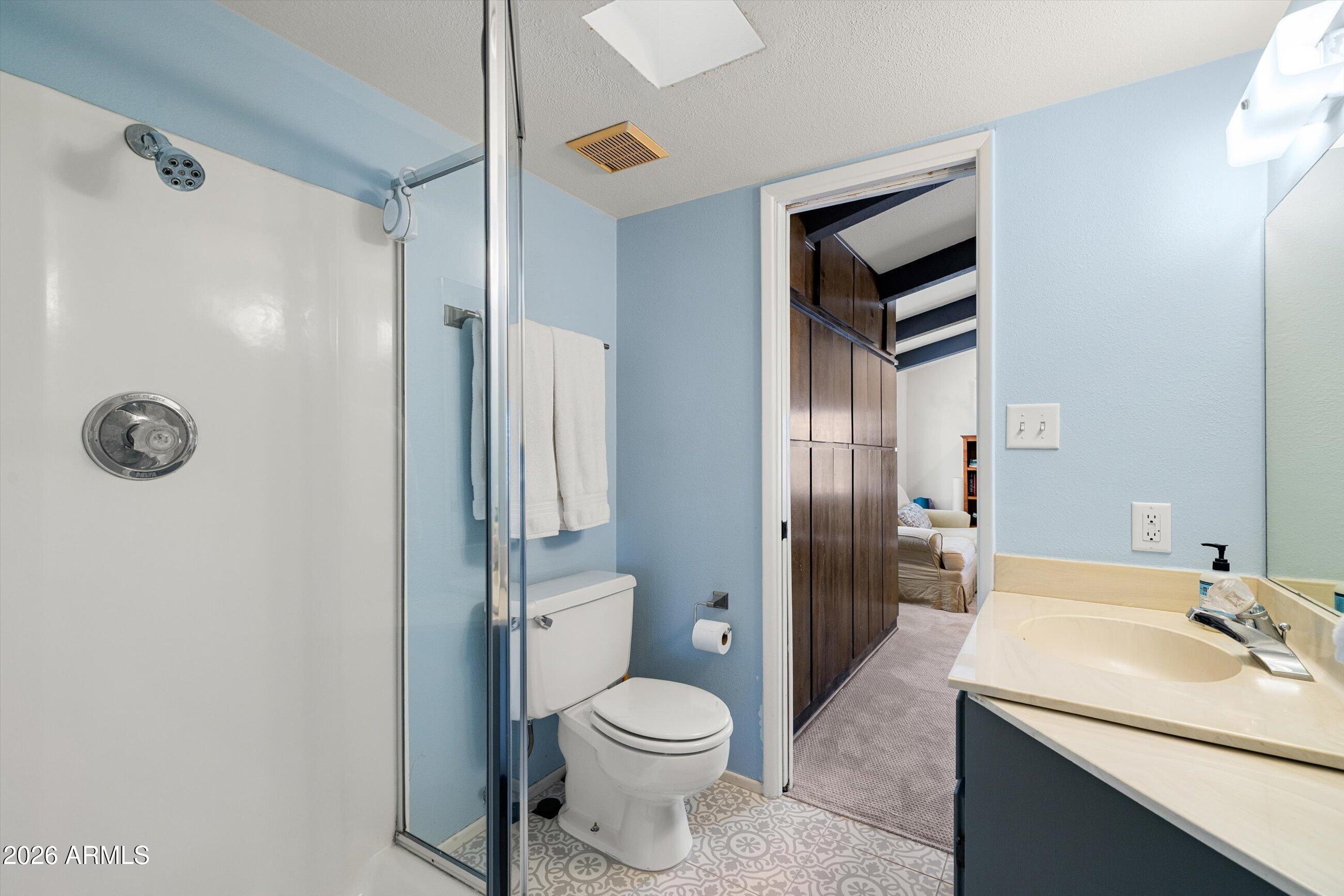 7142 North 14th Street Phoenix, AZ 85020 - Photo 24 of 29 a bathroom with a granite countertop sink toilet and shower