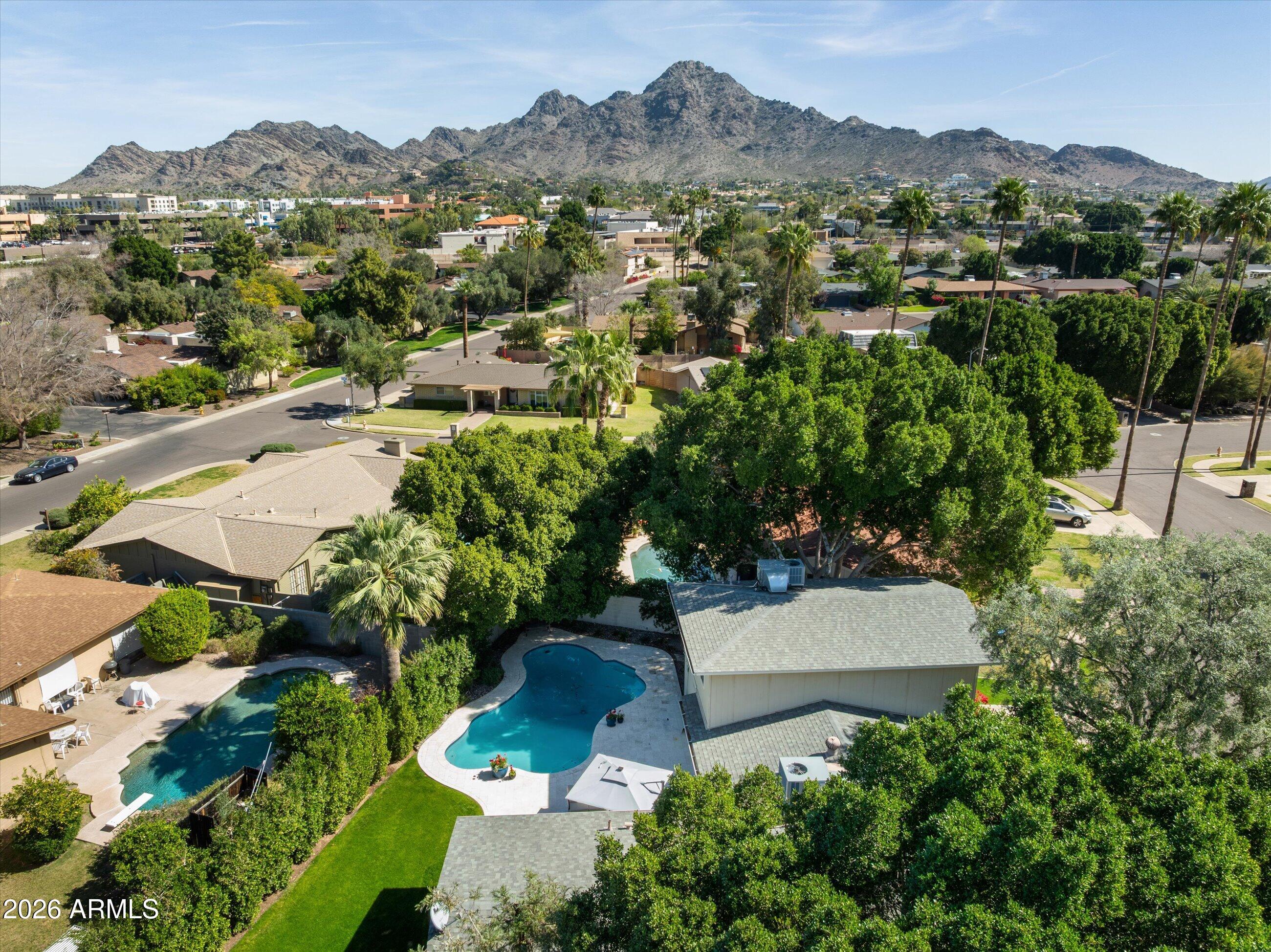 7142 North 14th Street Phoenix, AZ 85020 - Photo 28 of 29 an aerial view of green landscape with trees houses and mountain view
