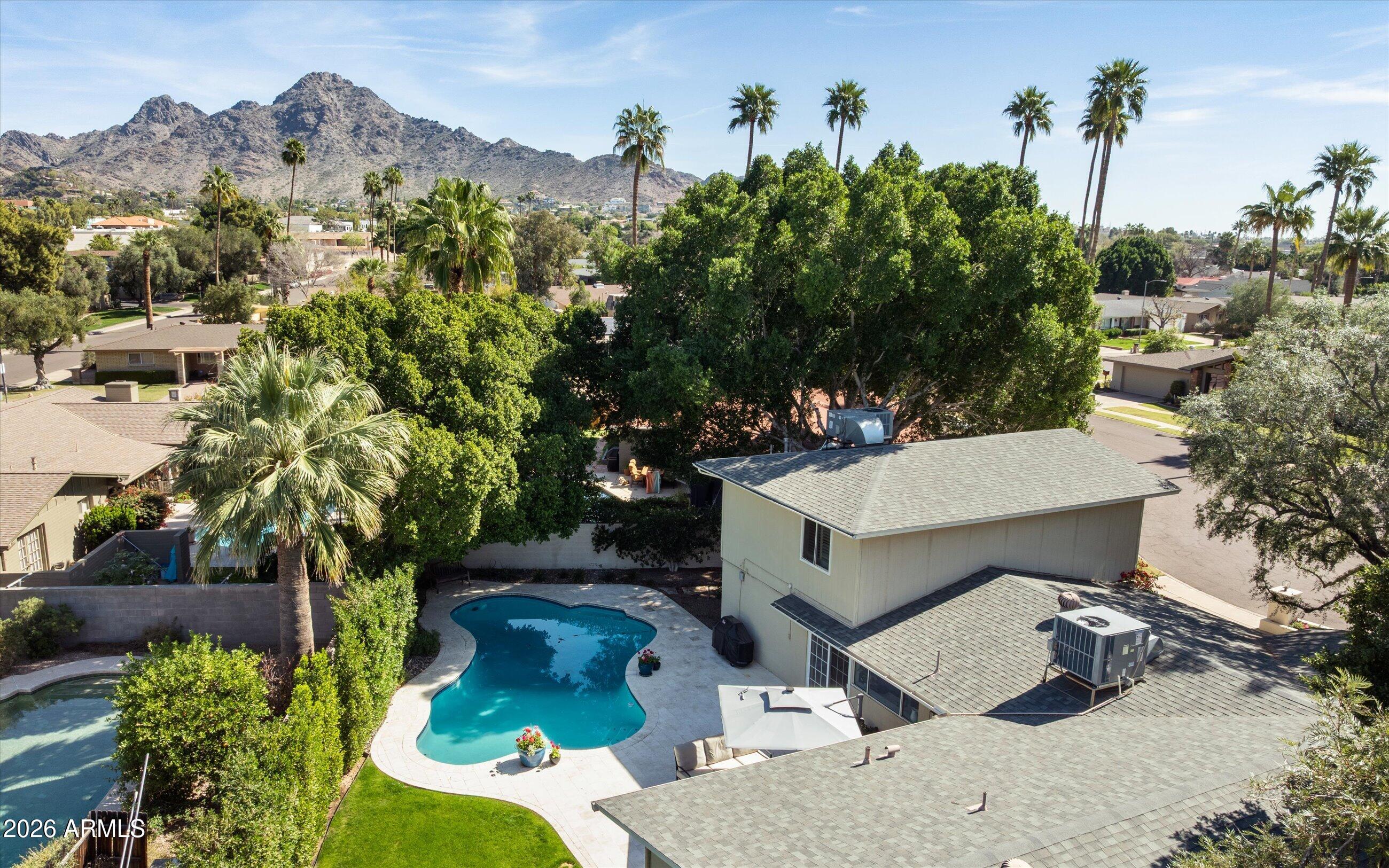 7142 North 14th Street Phoenix, AZ 85020 - Photo 4 of 29 an aerial view of a house with a yard