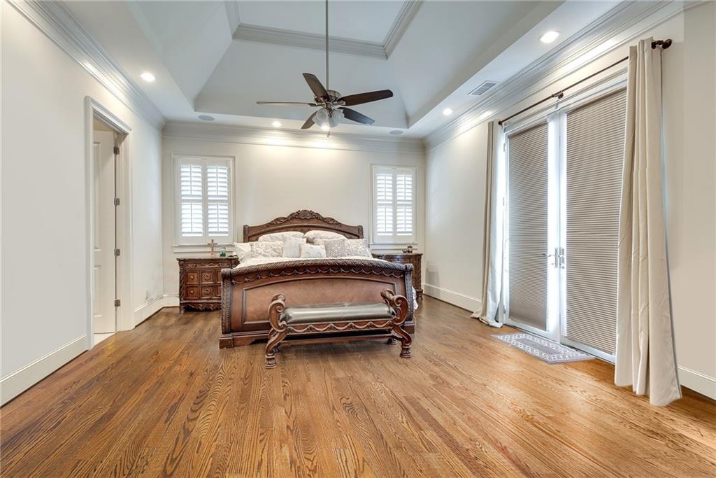 187 Fontaine Road Southwest Mableton, GA 30126 - Photo 33 of 84 a bedroom with a bed and a chandelier