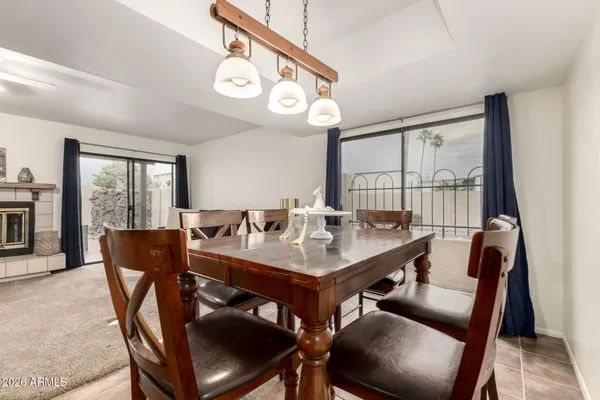a kitchen with a sink a refrigerator and cabinets