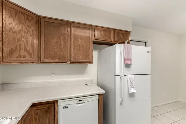 a kitchen with a stove a sink and a refrigerator