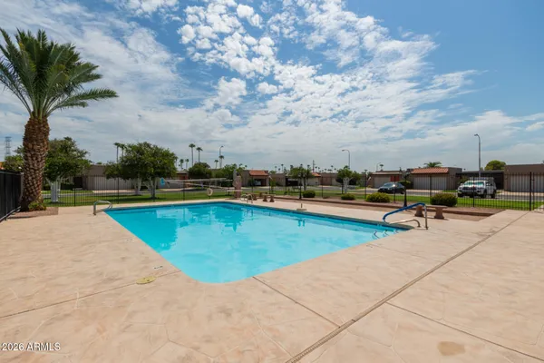 a room with furniture pool table and a large window