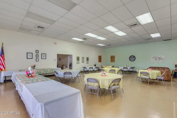 a room with furniture pool table and flat screen tv