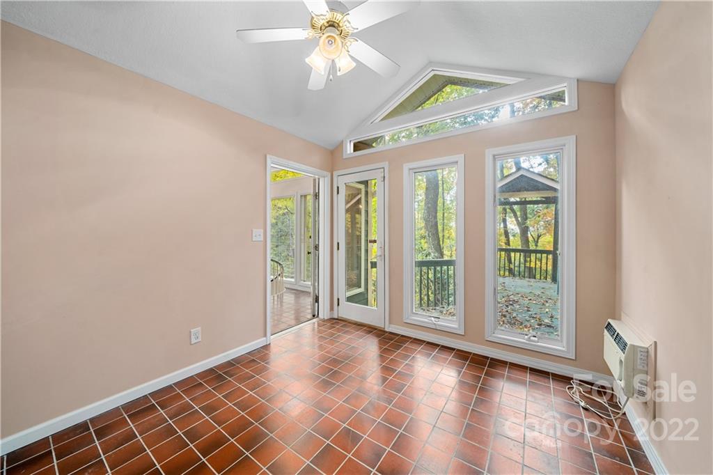 592 Mouzon Road Waynesville, NC 28785 - Photo 16 of 38 wooden floor in an empty room with a window