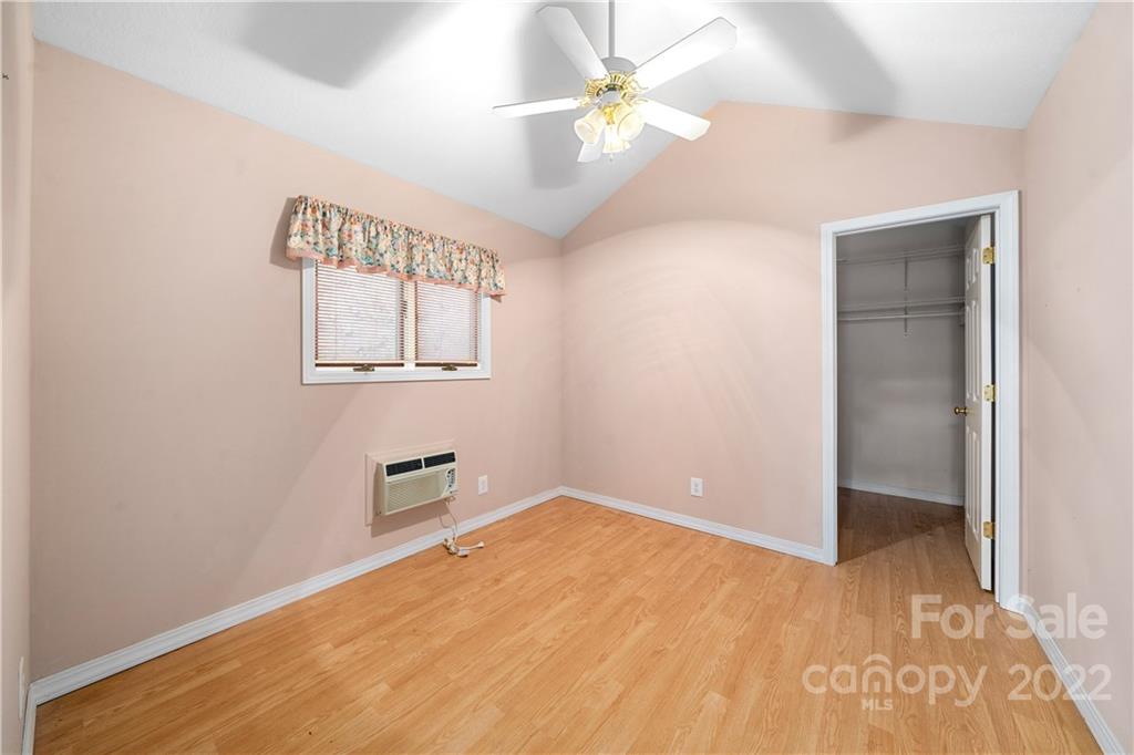 592 Mouzon Road Waynesville, NC 28785 - Photo 17 of 38 an empty room with windows and fan
