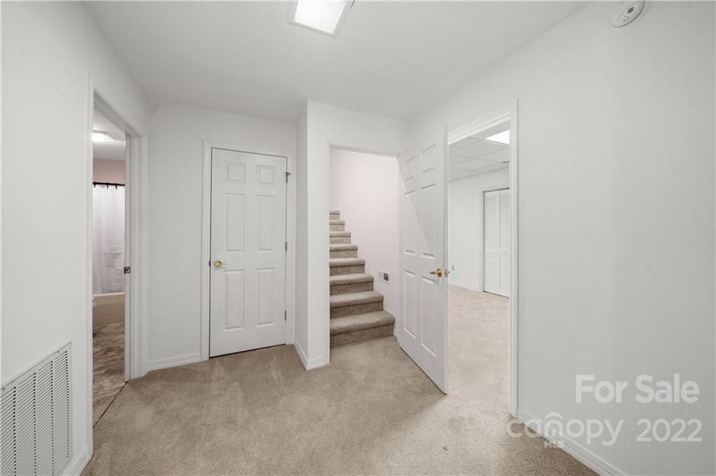 592 Mouzon Road Waynesville, NC 28785 - Photo 19 of 38 a view of a room with stairs and a bathroom