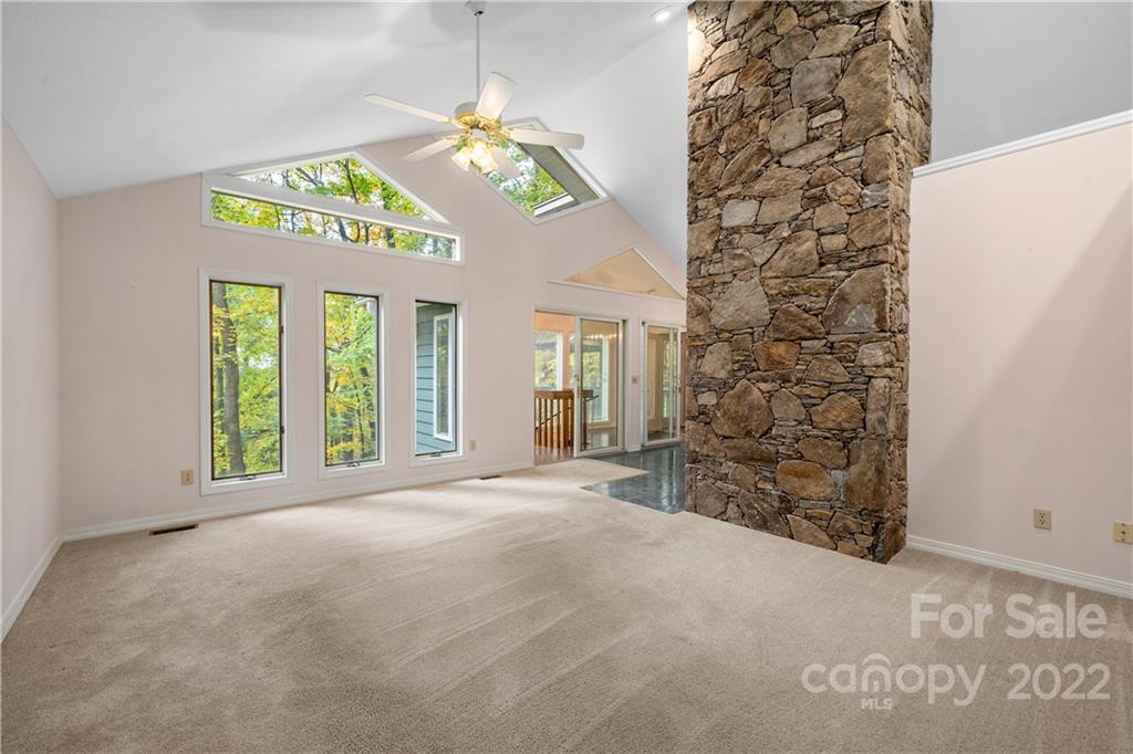 592 Mouzon Road Waynesville, NC 28785 - Photo 2 of 38 wooden floor in an empty room with a window