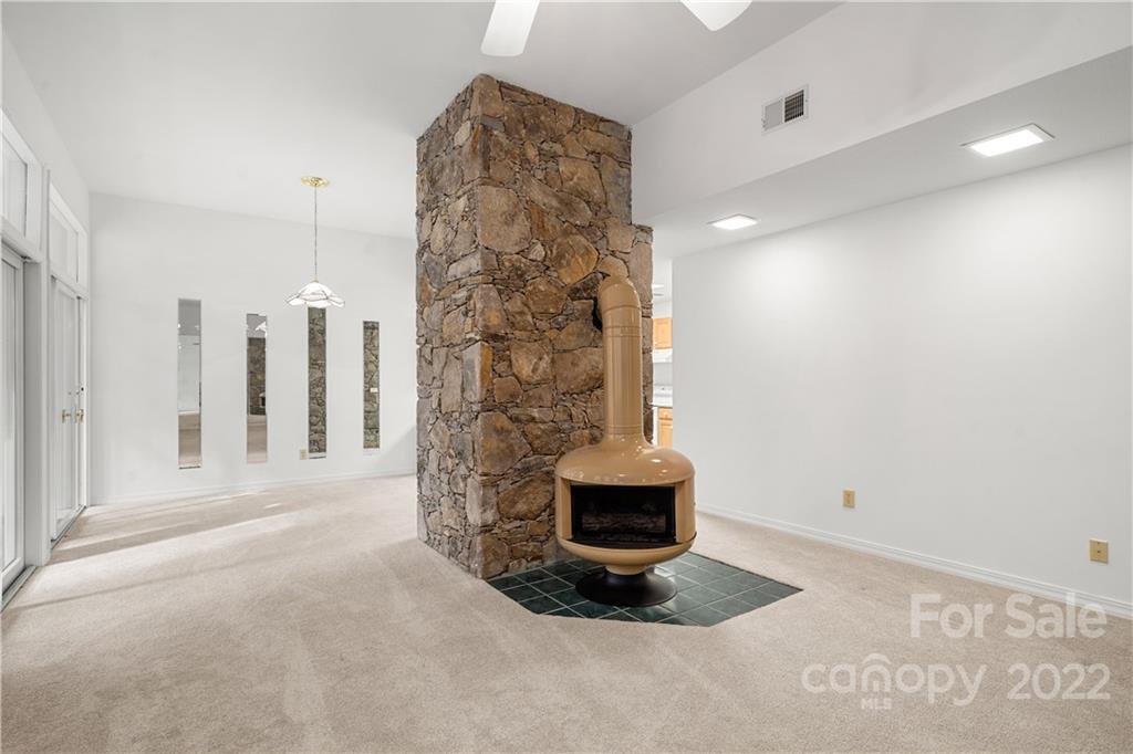 592 Mouzon Road Waynesville, NC 28785 - Photo 25 of 38 a view of water heater room with a floor to ceiling window