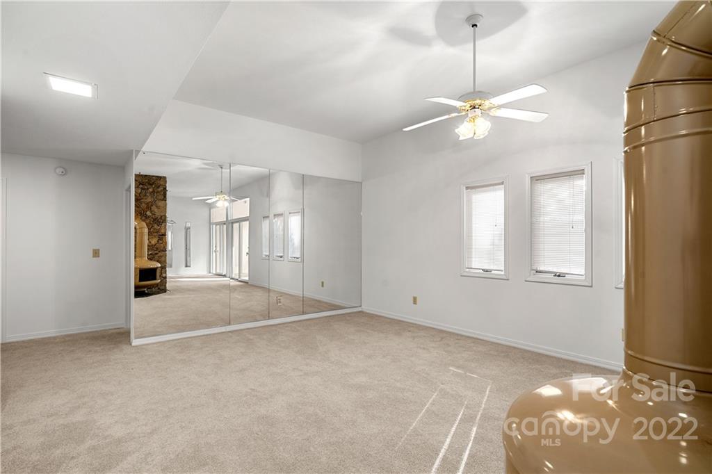 592 Mouzon Road Waynesville, NC 28785 - Photo 31 of 38 a view of an empty room with a window