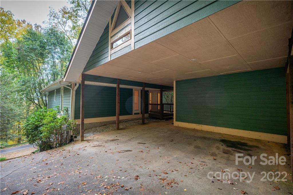 592 Mouzon Road Waynesville, NC 28785 - Photo 36 of 38 a view of a house with backyard and garden
